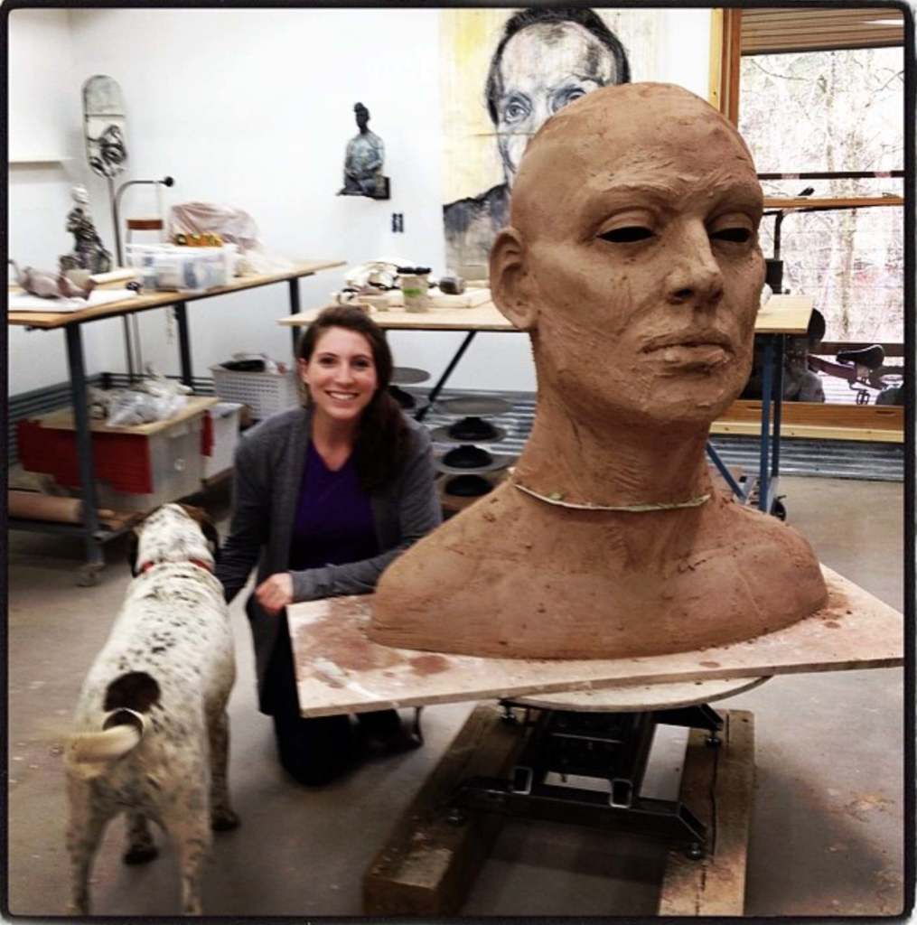 Rachel Ballard at Cristina Córdova studios in with a large head sculpture.